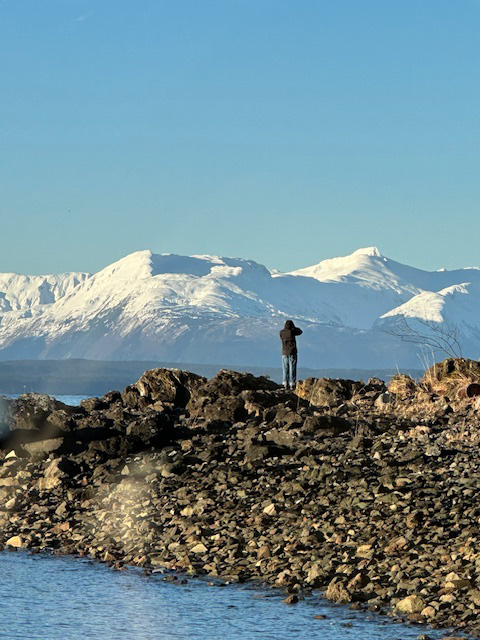 My grandson, who jumped off the boat to walk the beach and take photos.