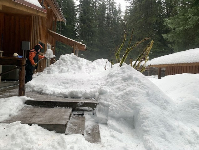 Robert shovels part of the deck
