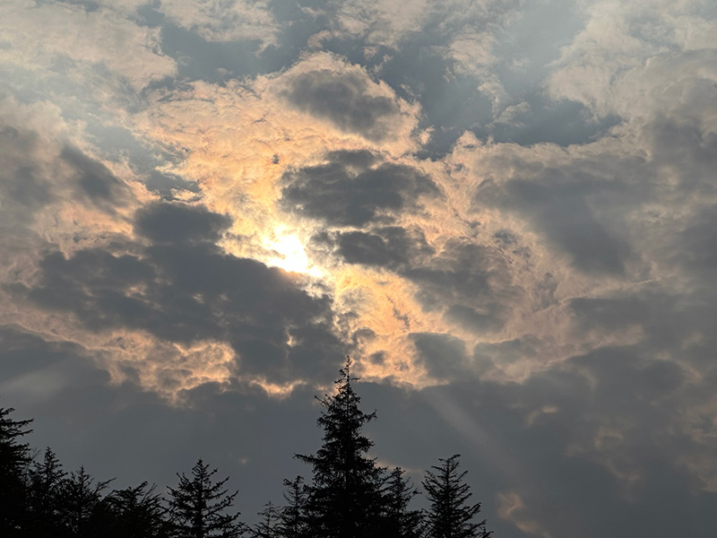 Sun peaking through clouds The sun tries to shine in a SE Alaska July day.