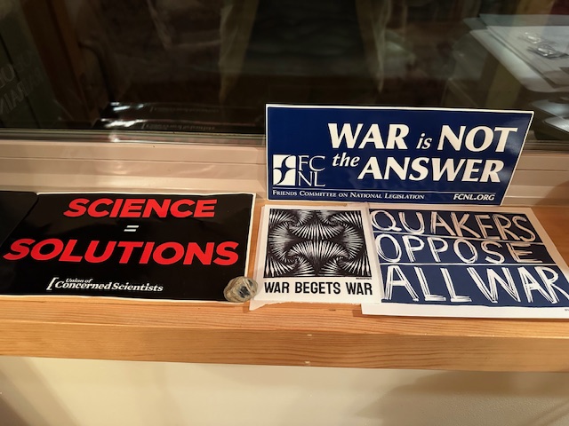 The signs on my windowsill by the door into my office. 